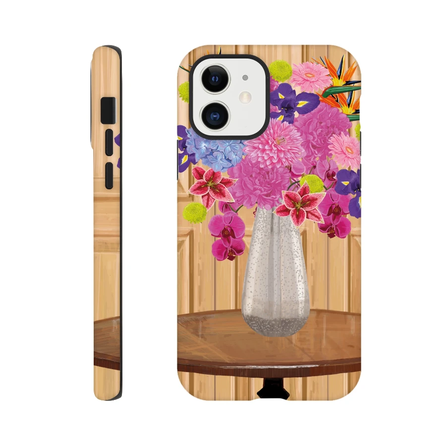 Vibrant floral bouquet in vase on wooden table, colorful orchids and lilies design