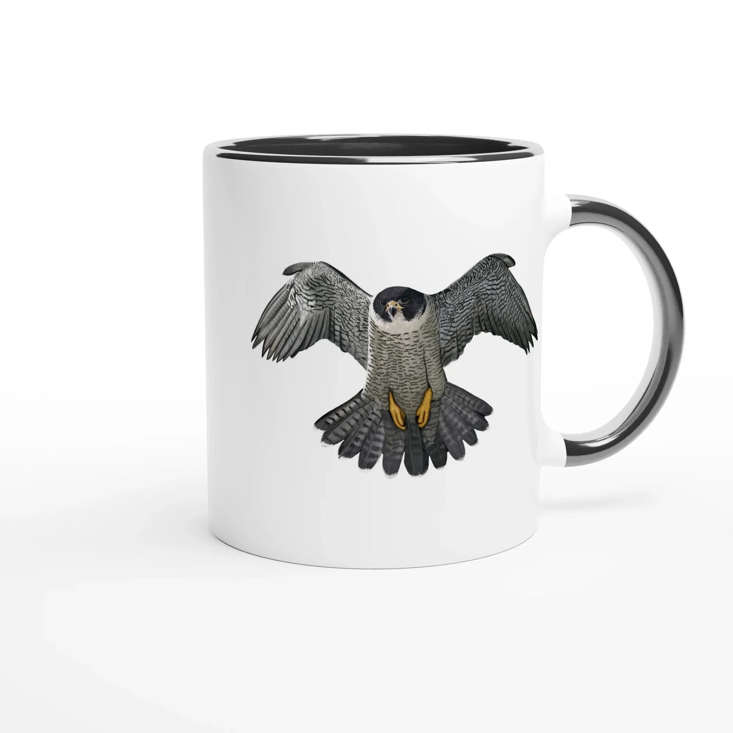 White mug with black rim featuring a detailed illustration of a peregrine falcon in flight, wings spread wide.