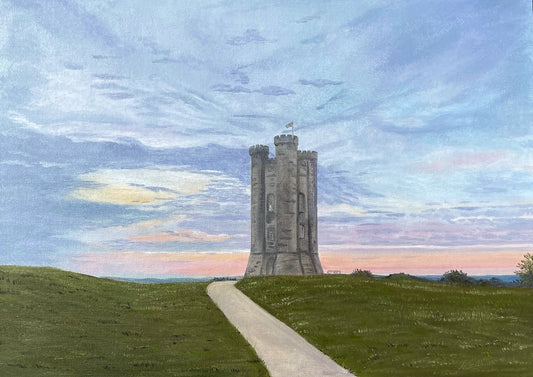 Watercolor painting of a stone tower monument on a grassy hill, with a path leading up to it under a cloudy blue and pink sky.