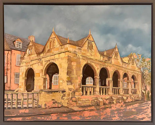 A framed painting depicting a historic stone building with arches and gabled roofs under a cloudy sky, rendered in warm ochre, brown, and gray tones.