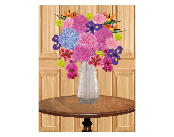 A vibrant floral arrangement featuring pink and purple flowers, blue hydrangeas, and orange bird of paradise blossoms in a textured silver vase, set on a wooden table against a light wood paneled background.